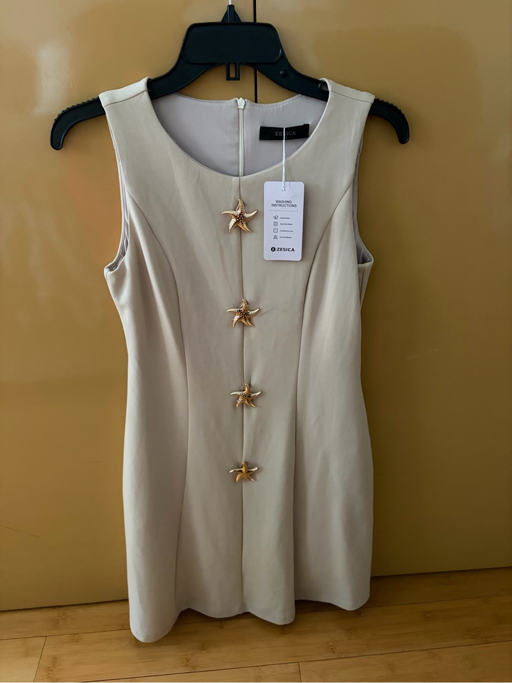 Sleeveless Cream Dress with Gold Starfish Buttons - Zesica